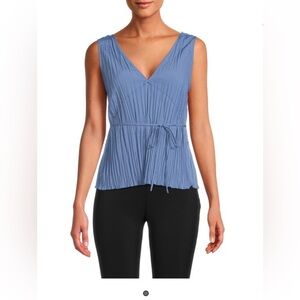 NWOT. Woman’s Vince pleated peplum top. Size L. In blue.